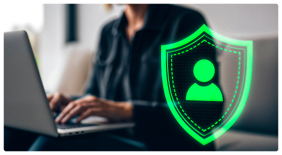 A person holding a device with a green shield icon