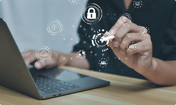 A person on a laptop with security icons floating around